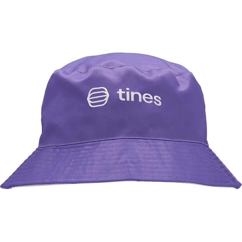 A purple bucket hat with a white embroidered 'tines' logo on the front, shown against a plain white background.