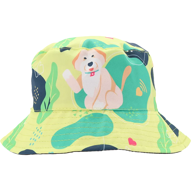 A children's bucket hat with a bright yellow-green base and a colorful cartoon dog print on the front, shown against a plain white background.
