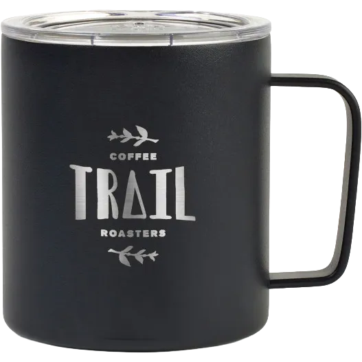 A matte black insulated mug with a clear lid and a black handle, featuring the text 'COFFEE TRAIL ROASTERS' in silver on the front, set against a plain white background.