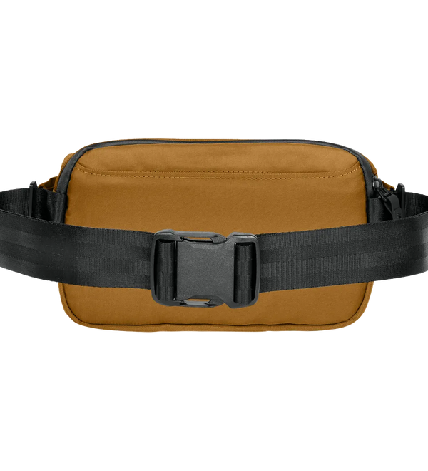 A tan canvas belt bag with a wide black adjustable strap and a black plastic quick-release buckle, shown against a plain white background.