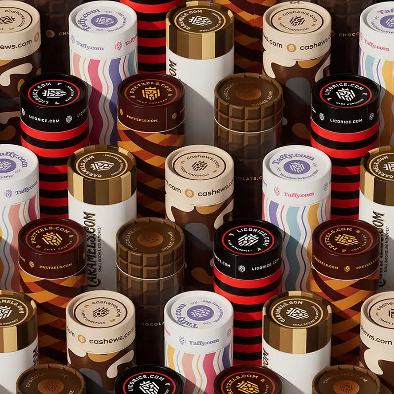 Collection of Taffy.com candy containers in various designs and colors.