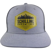 Gray cap with yellow and black Schilling Hard Cider logo on a white background