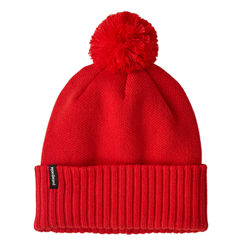 Red knit beanie with a pom-pom on a white background