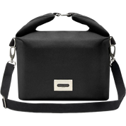 A black roll-top crossbody bag with a top handle, adjustable shoulder strap, and a silver-tone metal brand plaque on the front, shown against a plain white background