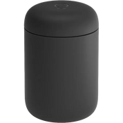 Black cylindrical container with lid on a white background