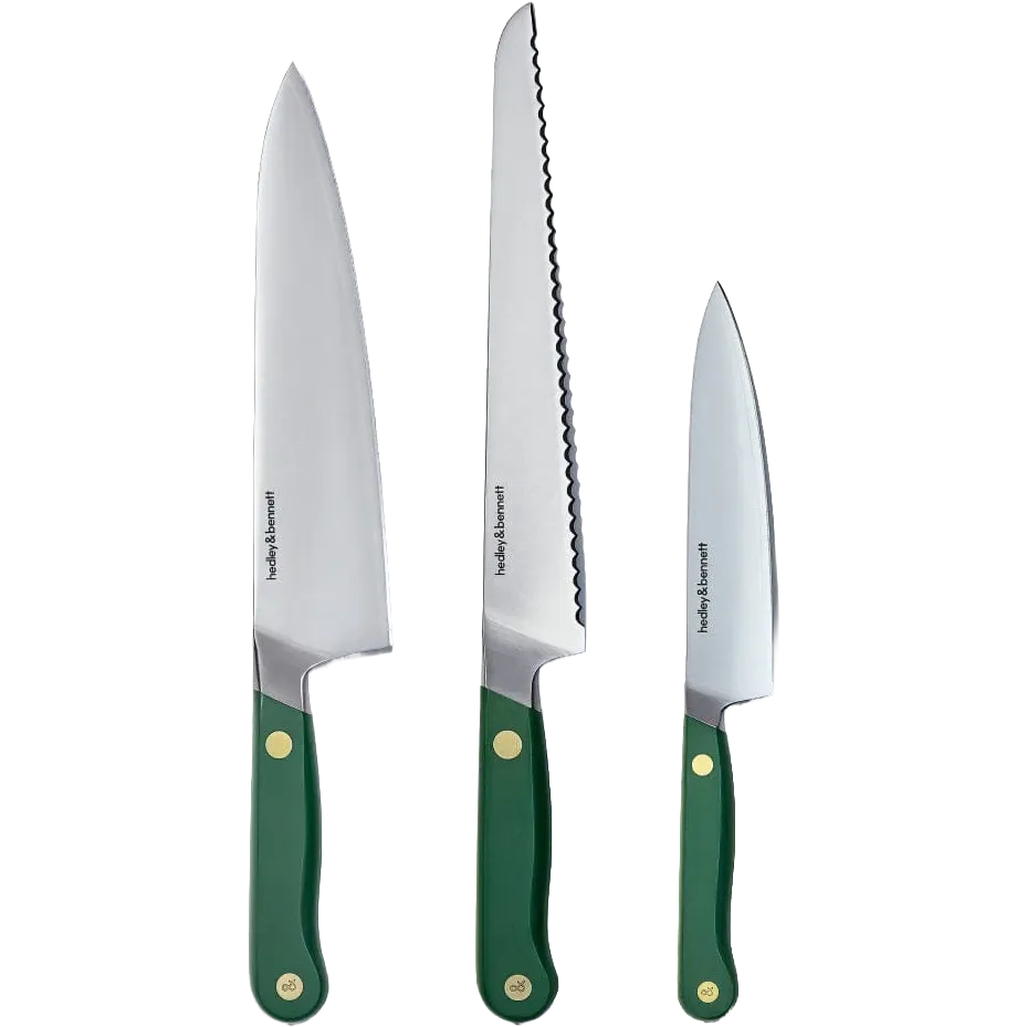 Three Hedley & Bennett stainless steel kitchen knives with green handles and brass rivets, shown vertically against a plain white background.