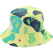 A yellow bucket hat with a colorful abstract pattern featuring green leaves, navy shapes, and a pink bunny illustration, shown on a plain white background.