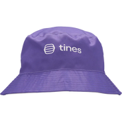 A purple bucket hat with a white embroidered 'tines' logo on the front, shown against a plain white background.
