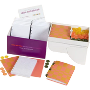 A children's play money game set featuring a white box with orange and yellow checkered coins, a purple money box with white playnotes, loose playnotes, orange and yellow checkered coins, and a small card labeled 'disc notebook'.