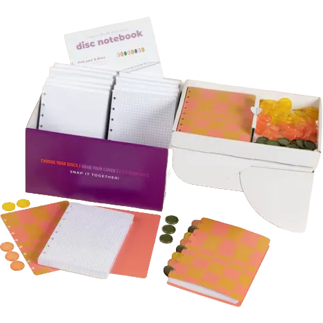 A children's play money game set featuring a white box with orange and yellow checkered coins, a purple money box with white playnotes, loose playnotes, orange and yellow checkered coins, and a small card labeled 'disc notebook'.