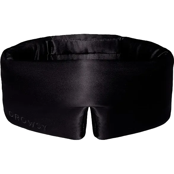 A black satin sleep mask with the brand name 'DROWSY' debossed on the lower left corner, shown against a plain white background.