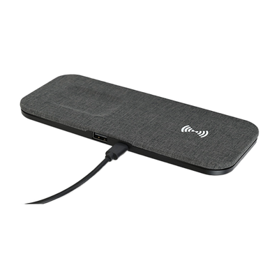 Black wireless charging pad with USB port on a white background