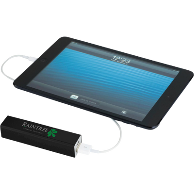 Tablet being charged by a power bank with 'Raintree' branding on a white background