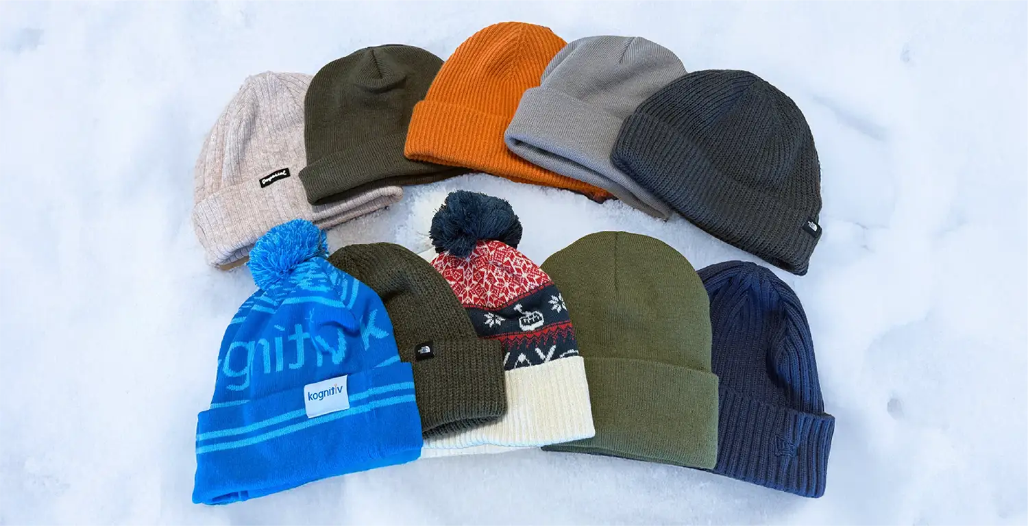 Winter beanie collection featuring knit cuffed beanies and pom-pom hats in assorted c