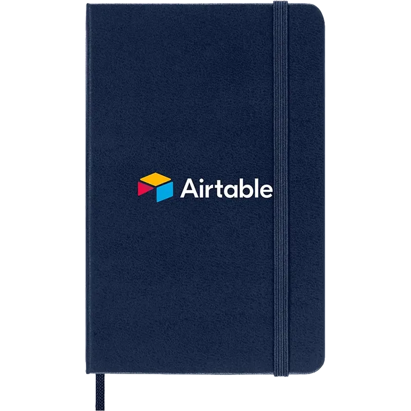 Navy Blue Moleskine Hard Cover Ruled Pocket Notebook featuring the Airtable logo, durable hard cover, elastic closure, ribbon bookmark, and rounded corners