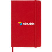 Scarlet Red Moleskine Hard Cover Ruled Pocket Notebook featuring the Airtable logo, durable hard cover, elastic closure band, ribbon bookmark, and rounded corners