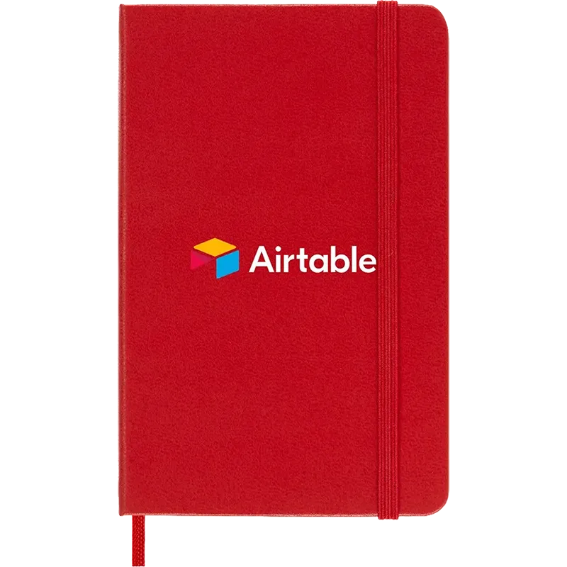 Scarlet Red Moleskine Hard Cover Ruled Pocket Notebook featuring the Airtable logo, durable hard cover, elastic closure band, ribbon bookmark, and rounded corners