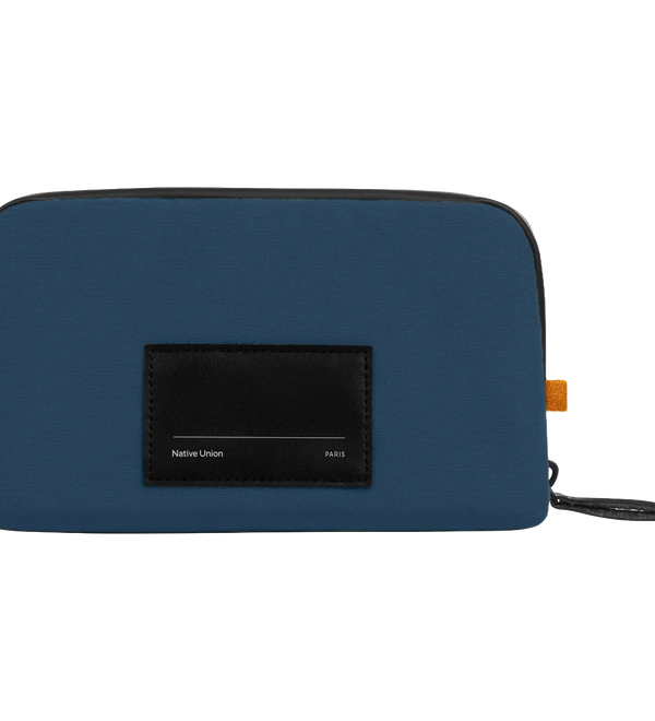 A blue zippered pouch with a black front label reading 'Native Union PARIS' and a small orange tab on the side, shown on a plain white background.