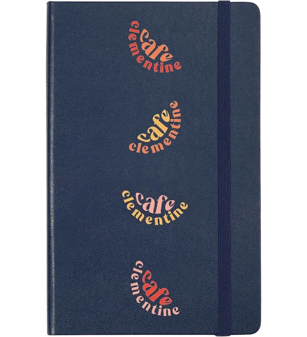 Navy Blue Moleskine Hard Cover Ruled Large Notebook featuring colorful Café Clementine artwork, durable hard cover, elastic closure band, ribbon bookmark, and rounded corners