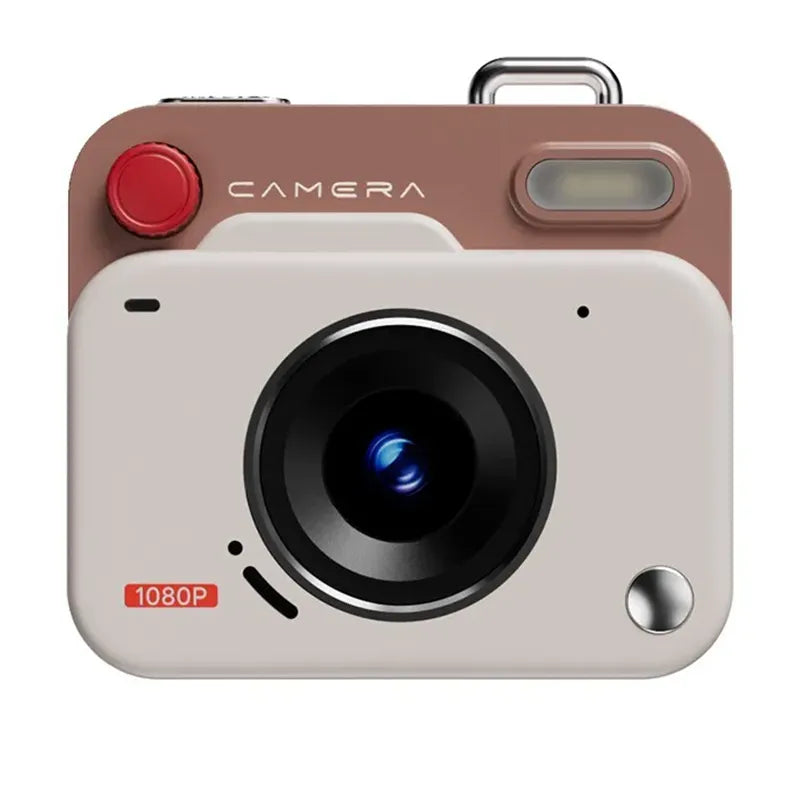A retro-style digital camera with a beige front, a dusty rose-brown top section, a red circular button, and a black lens, shown on a plain white background.