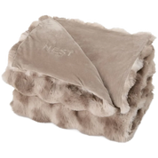 A folded plush throw blanket with a soft taupe fleece top and a lighter beige faux fur border, featuring the brand name 'NEST' embroidered on the fleece side.