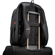 A black Samsonite backpack shown from the back, resting on top of a black rolling suitcase. The backpack features padded shoulder straps, a compression strap holding the suitcase handle, and a small red and white Samsonite logo on the side.