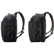 Two black backpacks shown side by side on a plain white background, photographed from the side profile to show the shape and compartments of the bag.