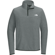 A heather gray quarter-zip pullover from The North Face, featuring a white embroidered logo on the left chest and a black zipper.