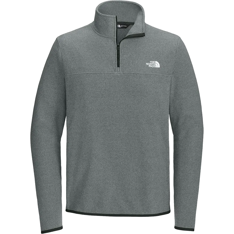 A heather gray quarter-zip pullover from The North Face, featuring a white embroidered logo on the left chest and a black zipper.