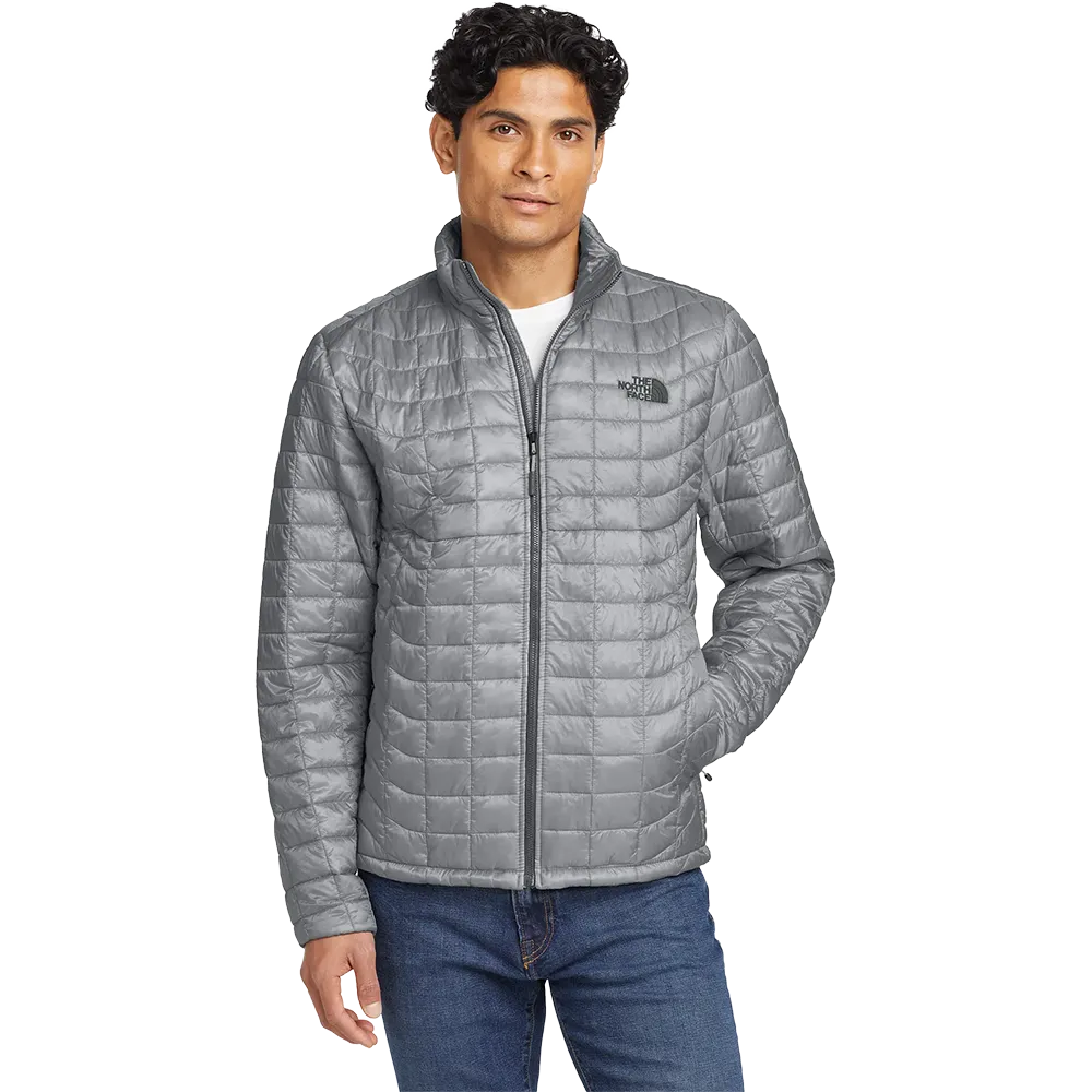 Model wearing The North Face ThermoBall Trekker insulated jacket in mid gray